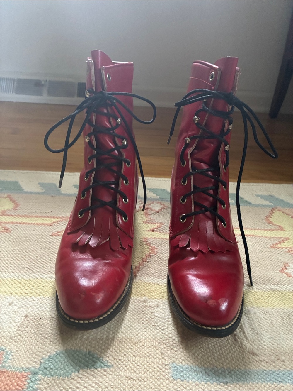 Vintage Justin red leather lace-up roper boots with fringe
